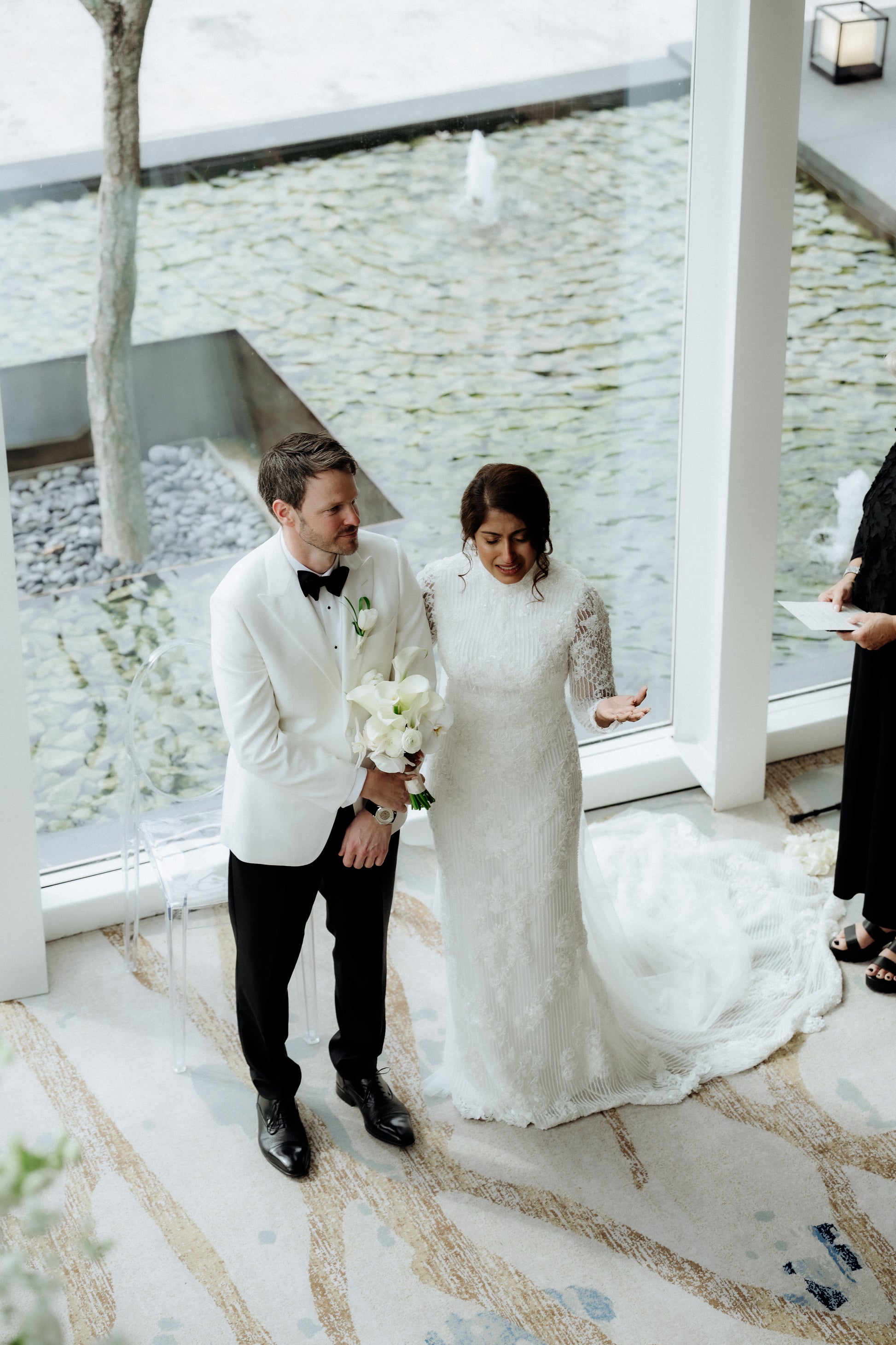 Intricate beaded wedding gown with lace detailing by Dentelle Bridal