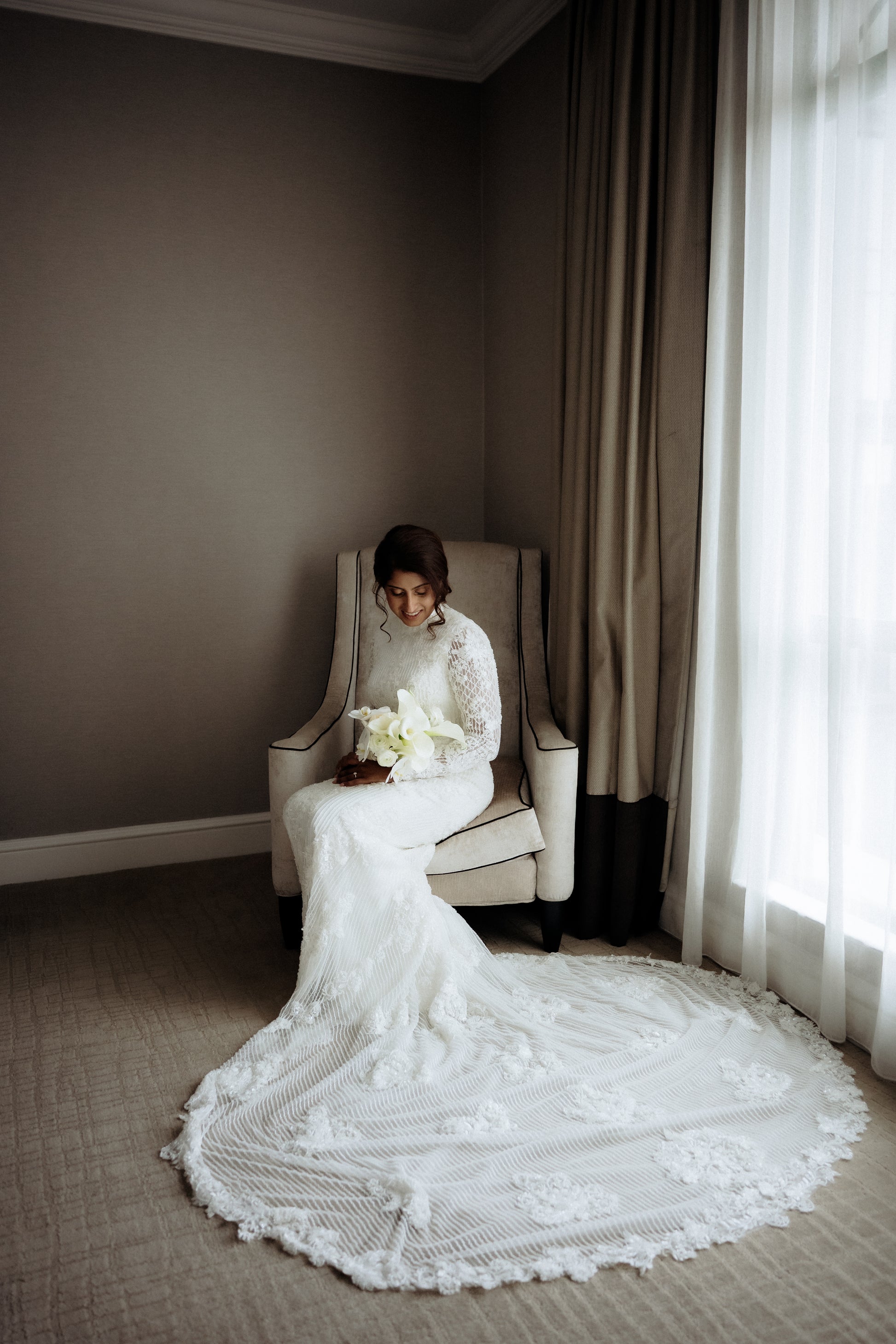 Custom couture bridal gown with beaded base and lace overlay