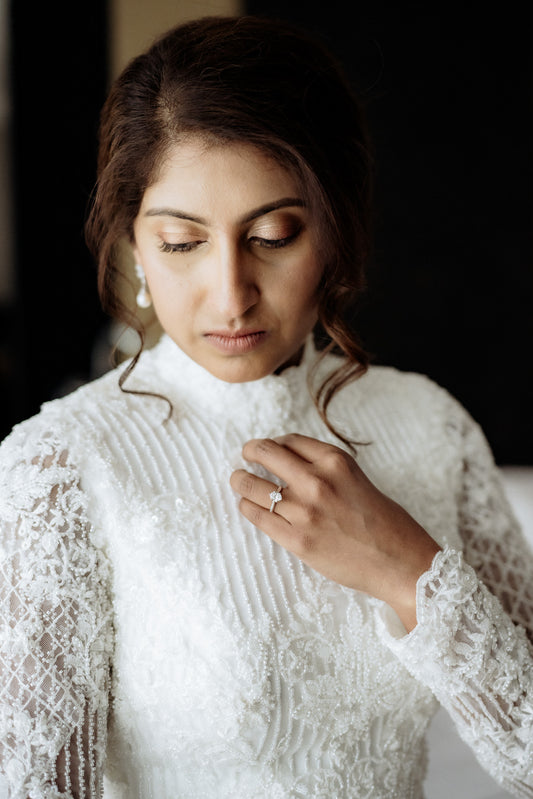 Intricate beaded wedding gown with lace detailing by Dentelle Bridal