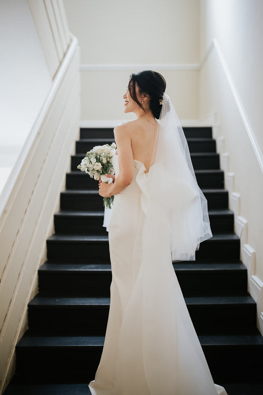 Sophisticated Simplicity: Juliet’s Clean-Cut Gown with a One-of-a-Kind Bow