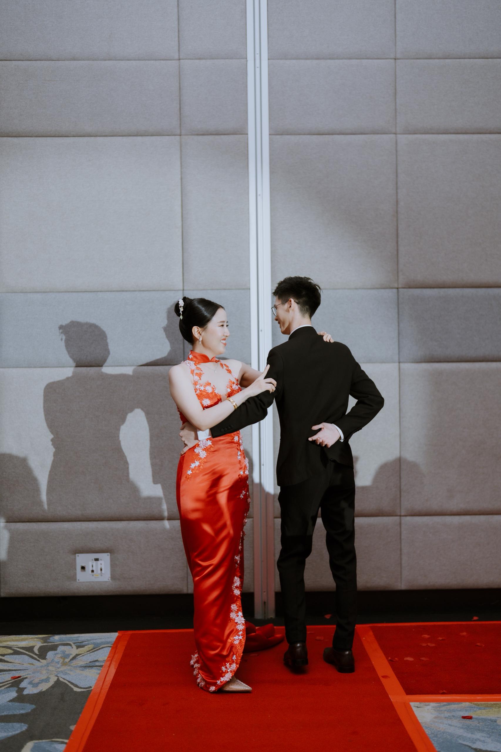 Red cheongsam-inspired bridal gown with intricate detailing