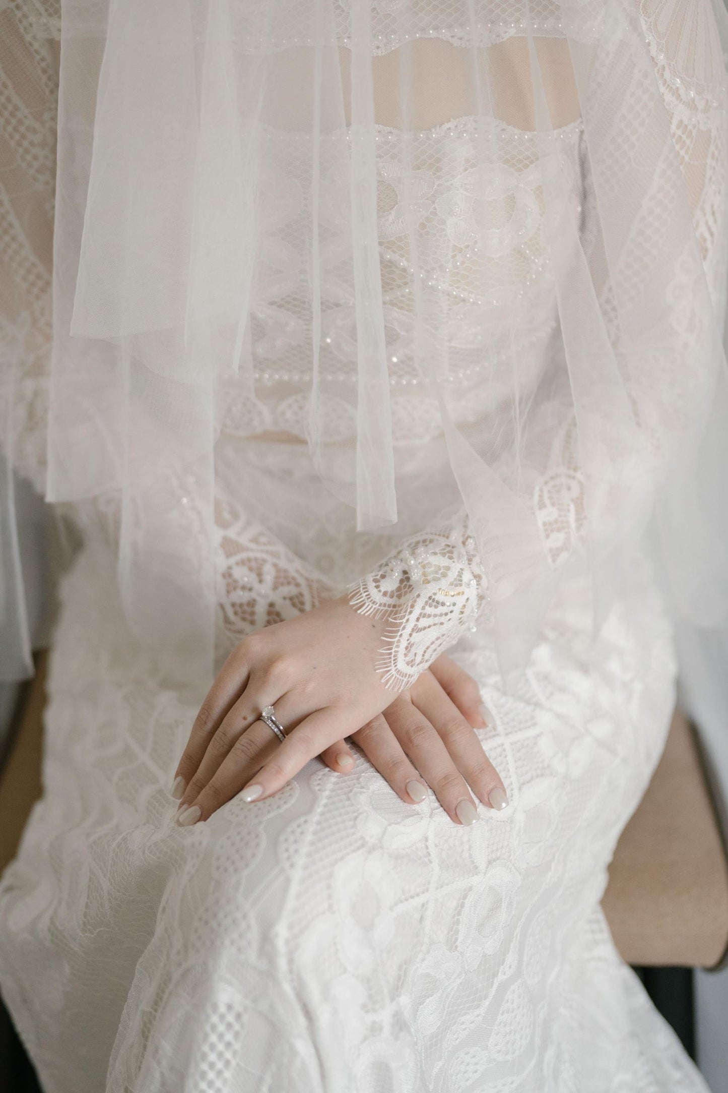 Intricate lace applique details on custom wedding dress