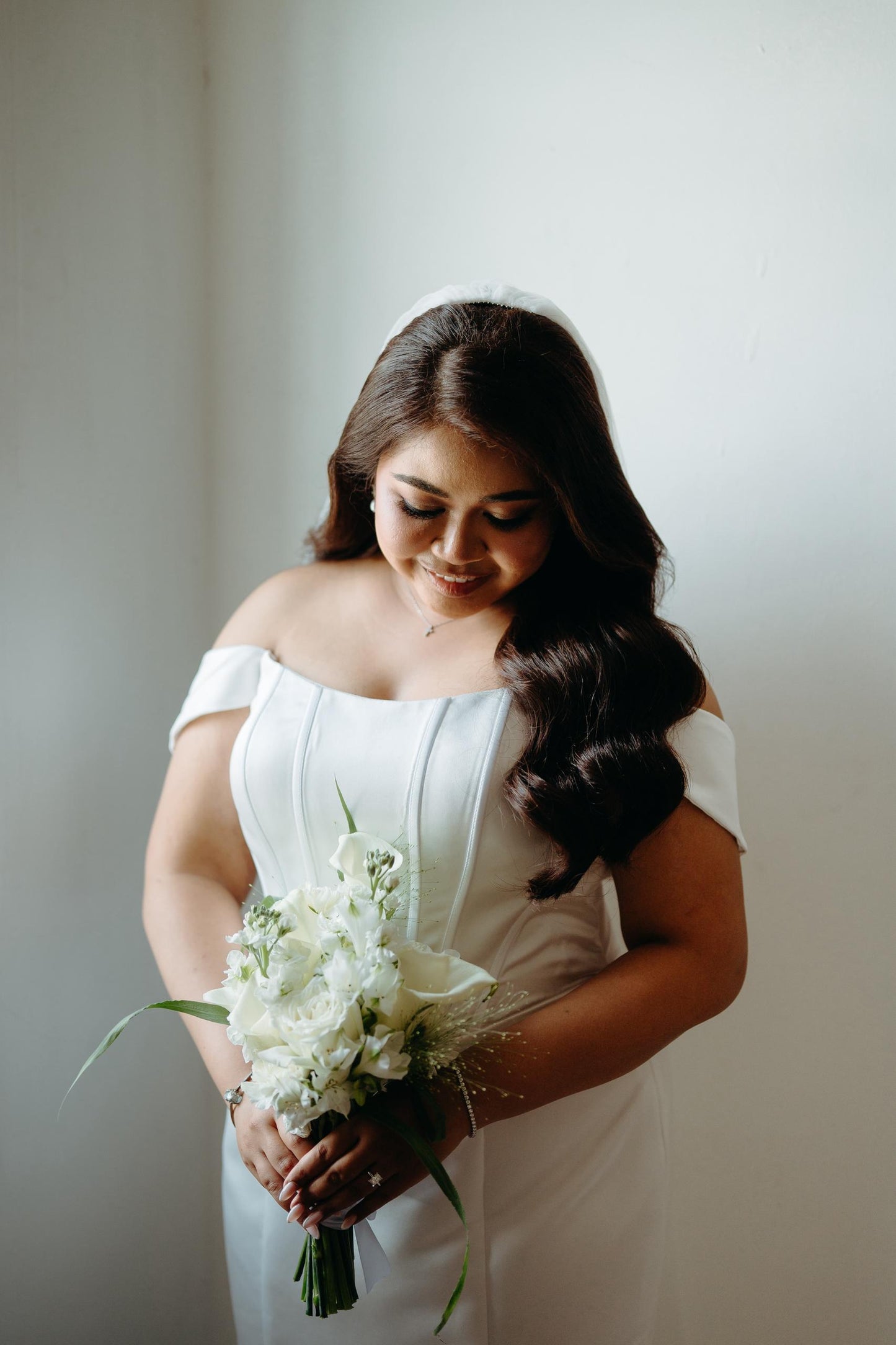 Custom corset wedding gown tailored to Bride Sharon's silhouette by Dentelle Bridal