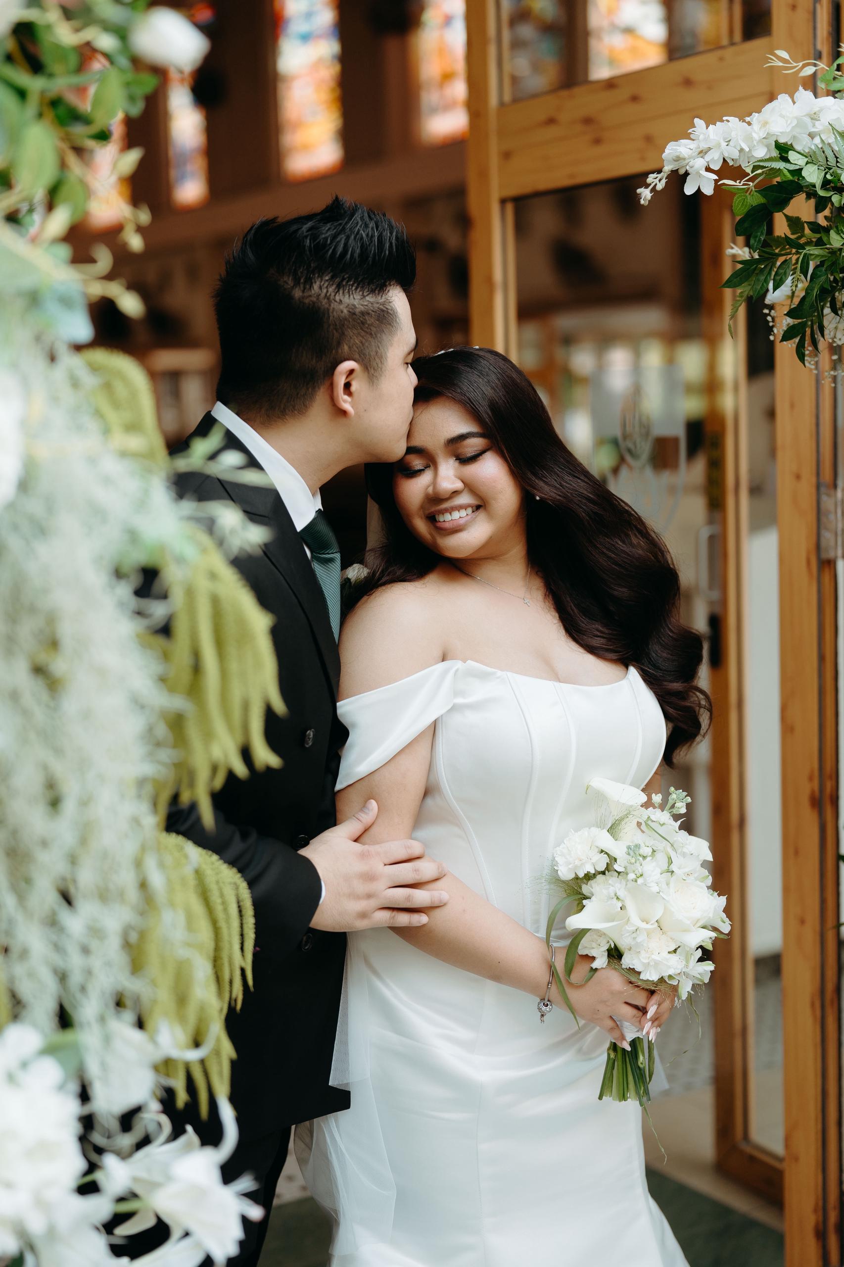 Custom wedding dress with figure-flattering corset bodice and fitted skirt