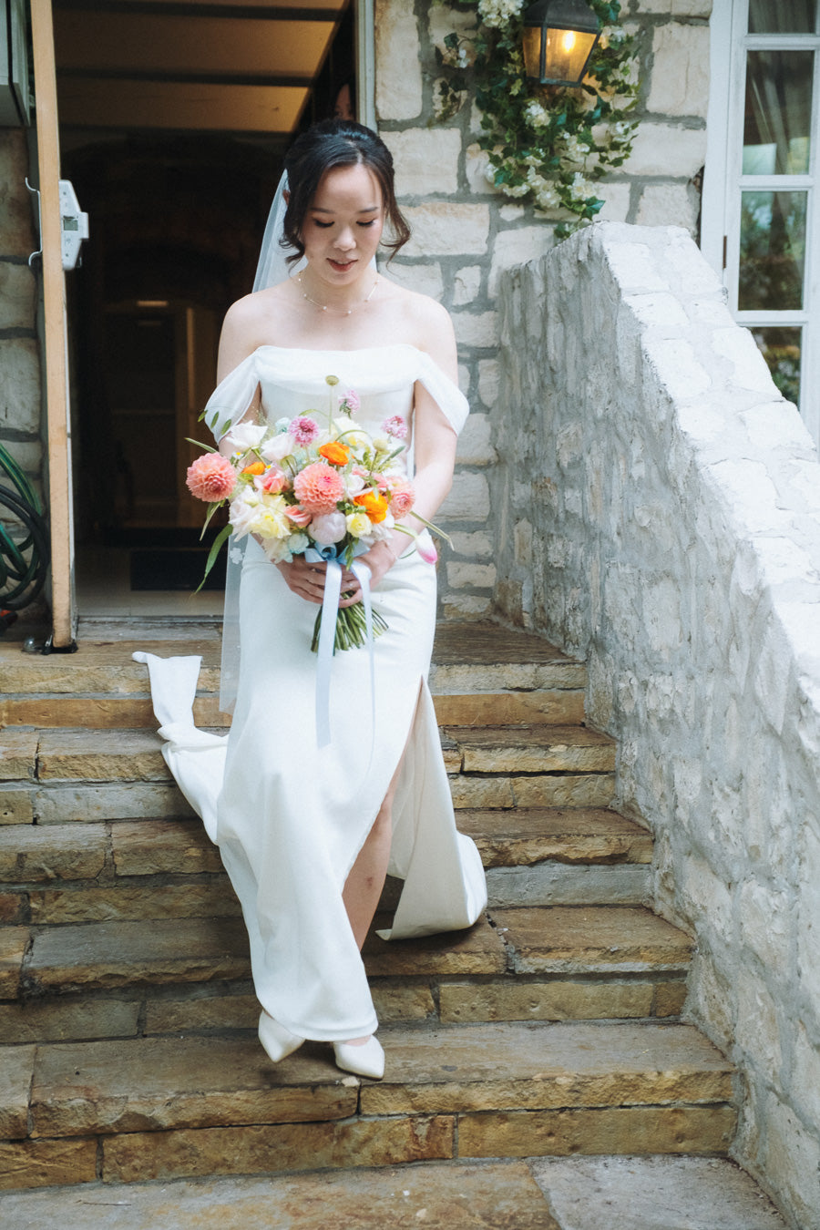 Bride Anna wearing custom wedding gown by Dentelle Bridal